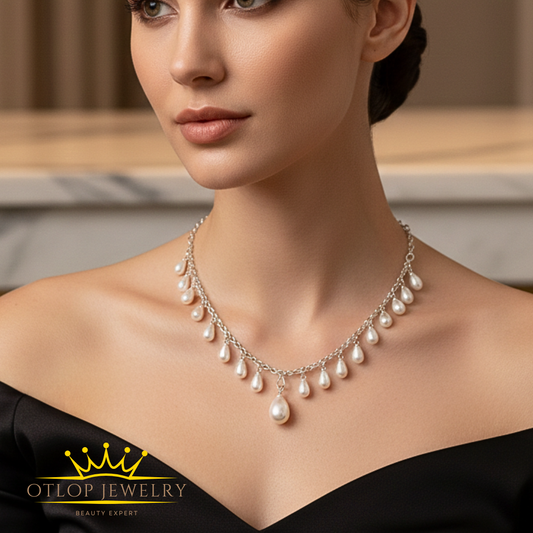 سلسله انيقه من الفضه يتدلي منها حبات من اللؤلؤ الطبيعي - كود 1020