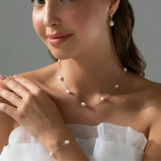 طقم مكون من سلسله و حلق و اسورة من الفضة مع اللؤلؤ الطبيعي - كود 05090