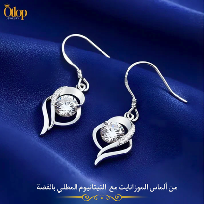 حلق نسائي بتصميم انسيابي فاخر .من التيتانيوم  المطلي بالفضة عيار 925 مع ألماس الموزانايت - كود 4122